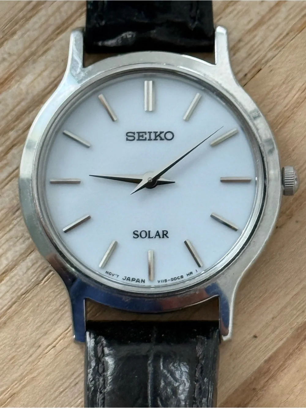Seiko Solar Ladies Watch White Round Dial Black Leather Strap Stainless Case